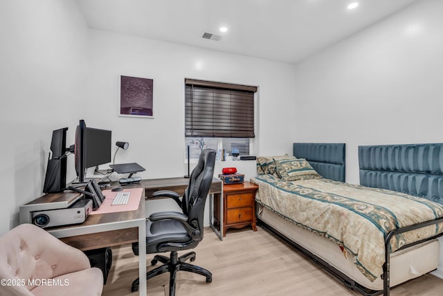 bedroom with recessed lighting, wood finished floors, and visible vents