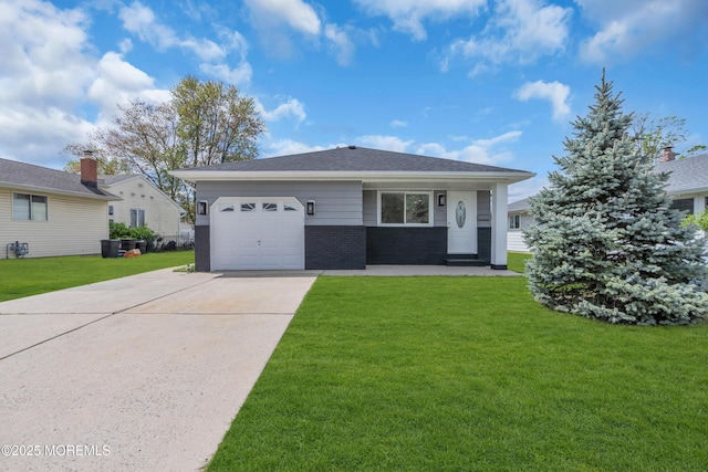 view of front facade with concrete driveway, brick siding, a front yard, and a garage