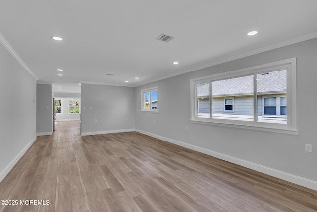 unfurnished room featuring baseboards and ornamental molding