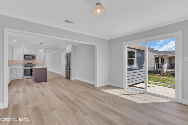 unfurnished living room with baseboards, crown molding, visible vents, and light wood-type flooring