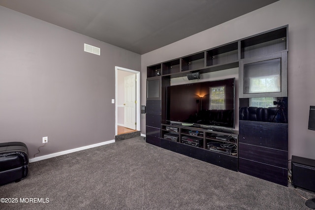 carpeted living area featuring baseboards and visible vents