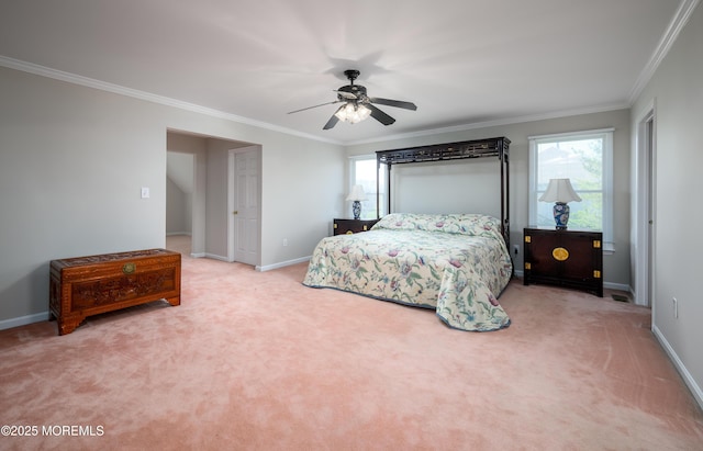 carpeted bedroom featuring crown molding, baseboards, and ceiling fan