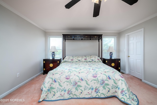 bedroom featuring crown molding, baseboards, carpet, and a ceiling fan