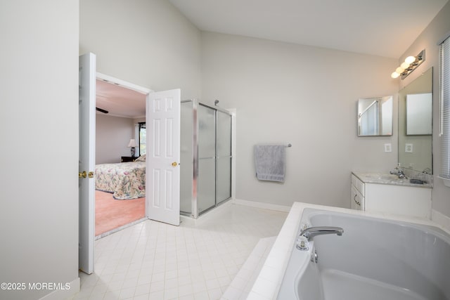 bathroom featuring vanity, ensuite bathroom, tile patterned floors, a bath, and a shower stall