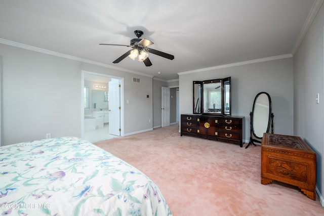 bedroom featuring ceiling fan, crown molding, baseboards, ensuite bathroom, and light carpet