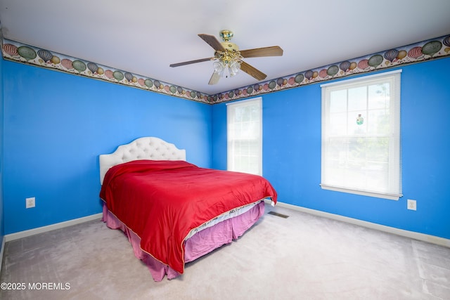 bedroom featuring baseboards, carpet flooring, and ceiling fan
