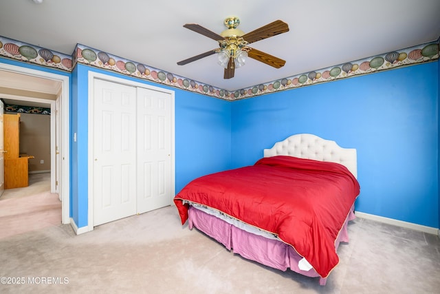 carpeted bedroom featuring baseboards, ceiling fan, and a closet