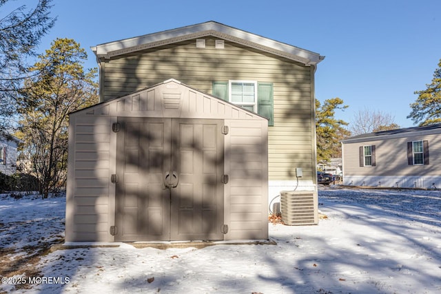 89 Woodchuck Pkwy, Whiting, NJ 08759 - snow covered structure with a storage unit, central AC unit, and an outdoor structure