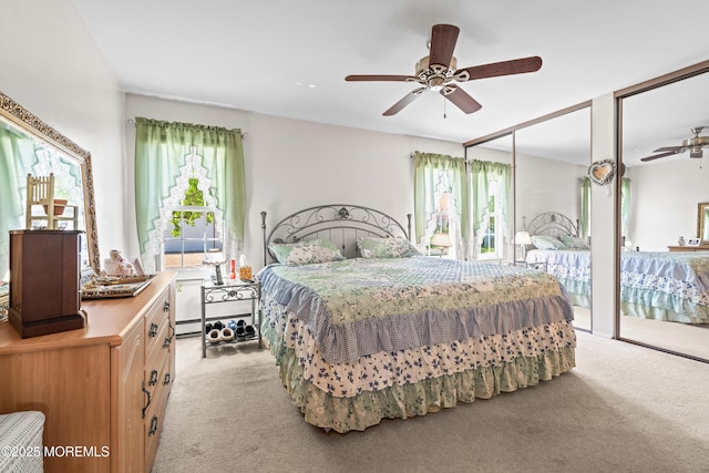 435B New Castle Ct, Manchester, NJ 08759 - bedroom featuring two closets, a ceiling fan, and light carpet