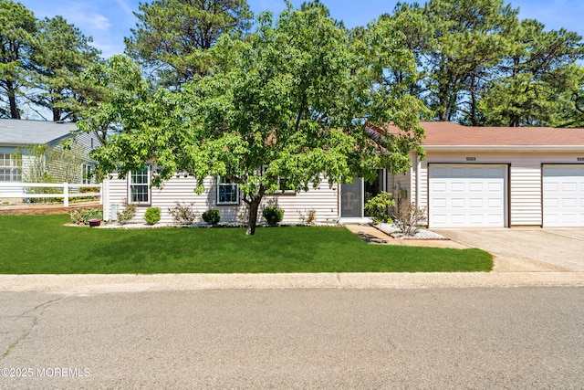 435B New Castle Ct, Manchester, NJ 08759 - view of front of property featuring fence, an attached garage, driveway, and a front lawn