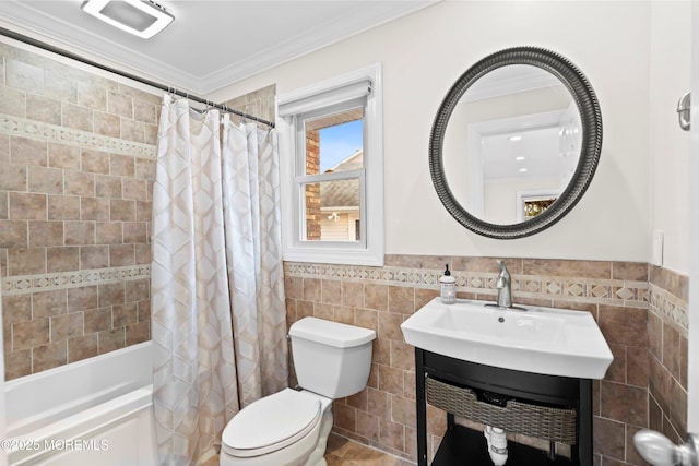 full bathroom with ornamental molding, shower / bath combination with curtain, toilet, and tile walls