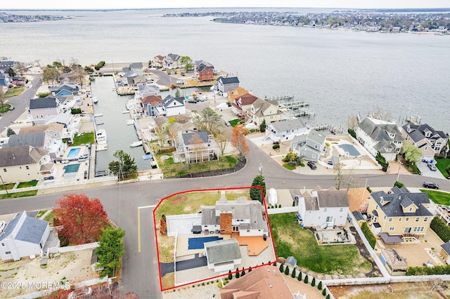 aerial view with a residential view and a water view