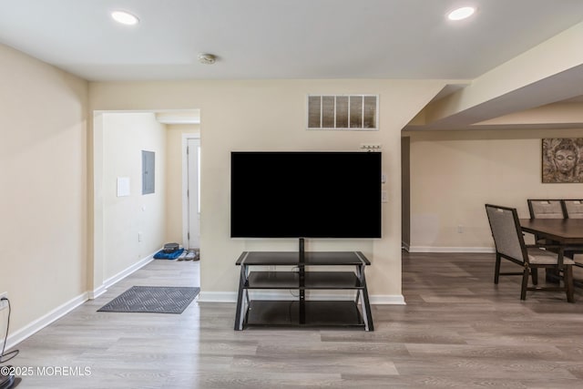 1603 Berkeley Ave, Beachwood, NJ 08722 - living area with electric panel, recessed lighting, wood finished floors, and baseboards