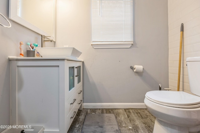 1603 Berkeley Ave, Beachwood, NJ 08722 - bathroom featuring toilet, wood finished floors, baseboards, and vanity