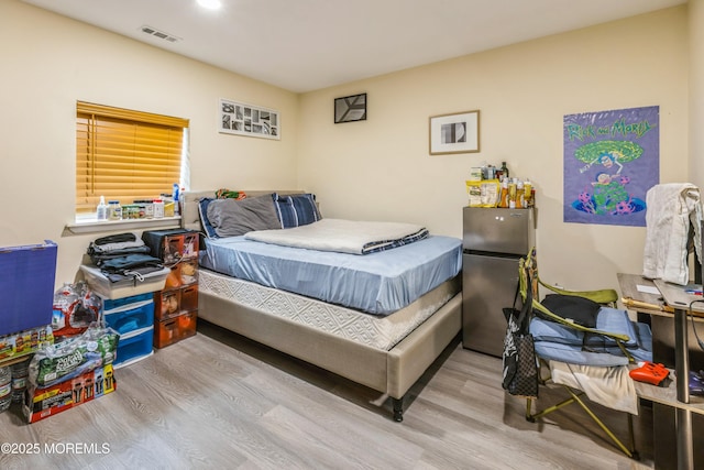 1603 Berkeley Ave, Beachwood, NJ 08722 - bedroom featuring freestanding refrigerator and wood finished floors