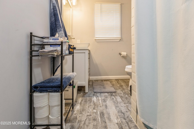 1603 Berkeley Ave, Beachwood, NJ 08722 - full bathroom with wood finished floors, toilet, vanity, and baseboards
