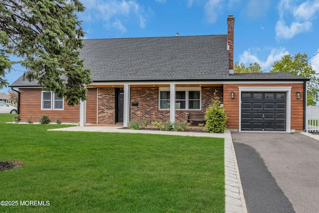 view of front of property featuring a garage, a front yard, asphalt driveway, and a chimney