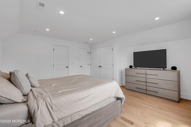 bedroom featuring recessed lighting, light wood finished floors, and baseboards