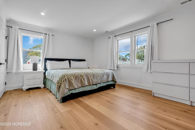 bedroom with ornamental molding, light wood-type flooring, baseboards, and recessed lighting