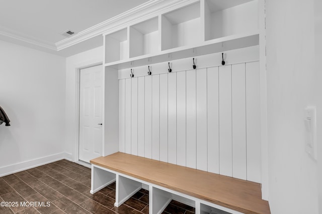mudroom with crown molding, baseboards, and dark wood-type flooring
