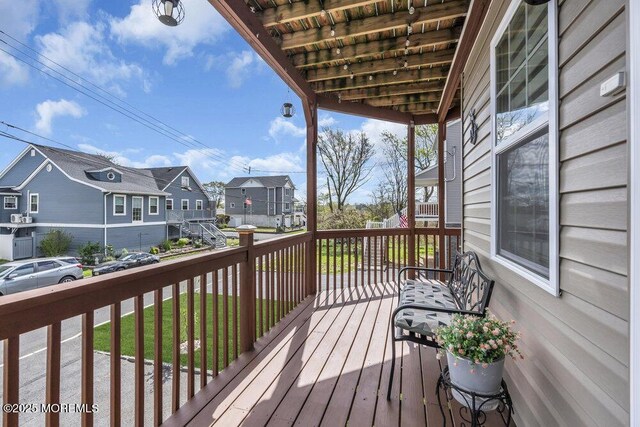 wooden terrace with a residential view