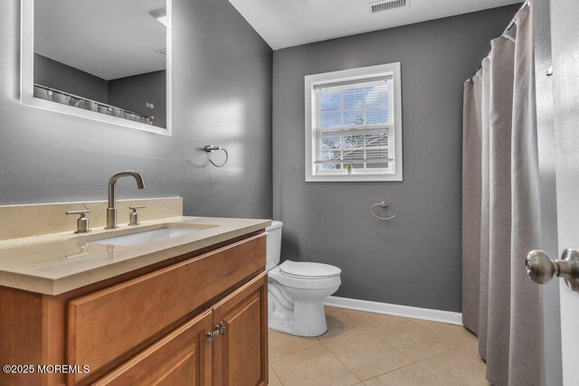 bathroom with visible vents, tile patterned flooring, baseboards, vanity, and toilet