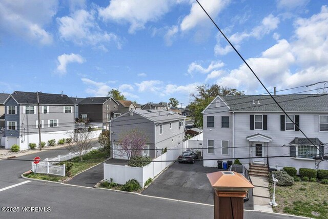 exterior space with traffic signs and a residential view