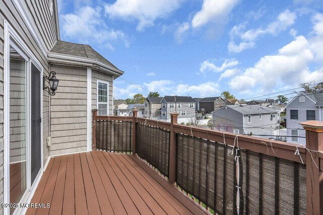 wooden deck with a residential view