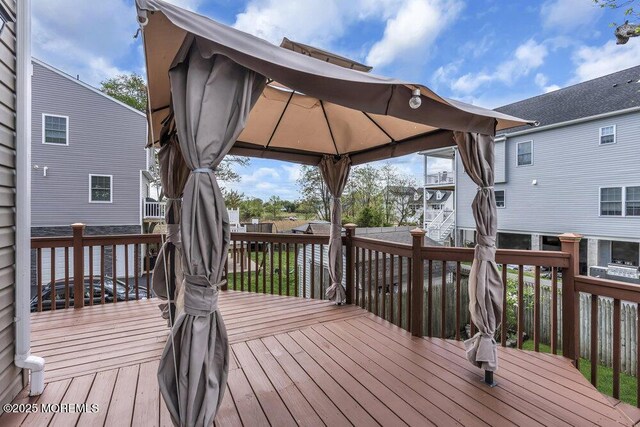 wooden terrace with a gazebo