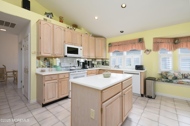 2271 Kira Ct, Toms River, NJ 08755 - kitchen featuring white appliances, light brown cabinetry, light countertops, lofted ceiling, and recessed lighting