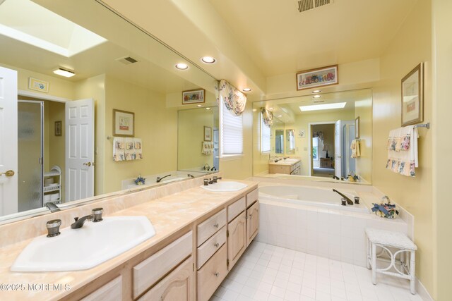 2271 Kira Ct, Toms River, NJ 08755 - full bathroom featuring tile patterned flooring, a bath, double vanity, recessed lighting, and an enclosed shower