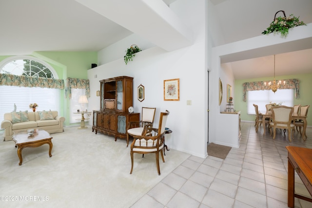 2271 Kira Ct, Toms River, NJ 08755 - living room featuring a chandelier, high vaulted ceiling, plenty of natural light, light tile patterned floors, and baseboards