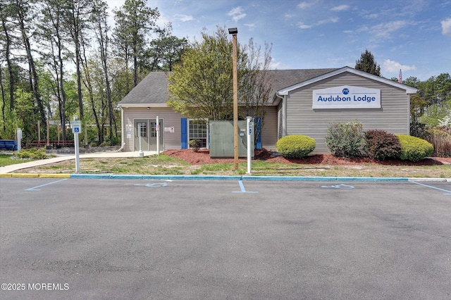 view of property featuring uncovered parking