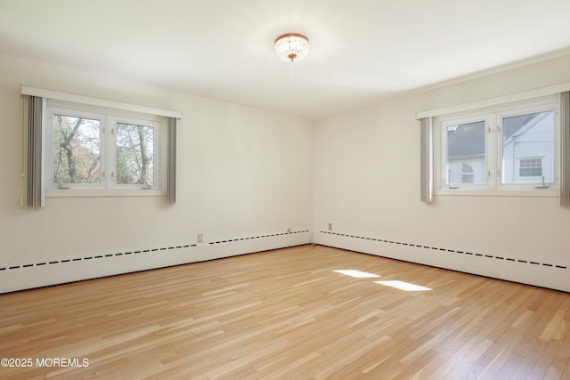 spare room featuring wood finished floors