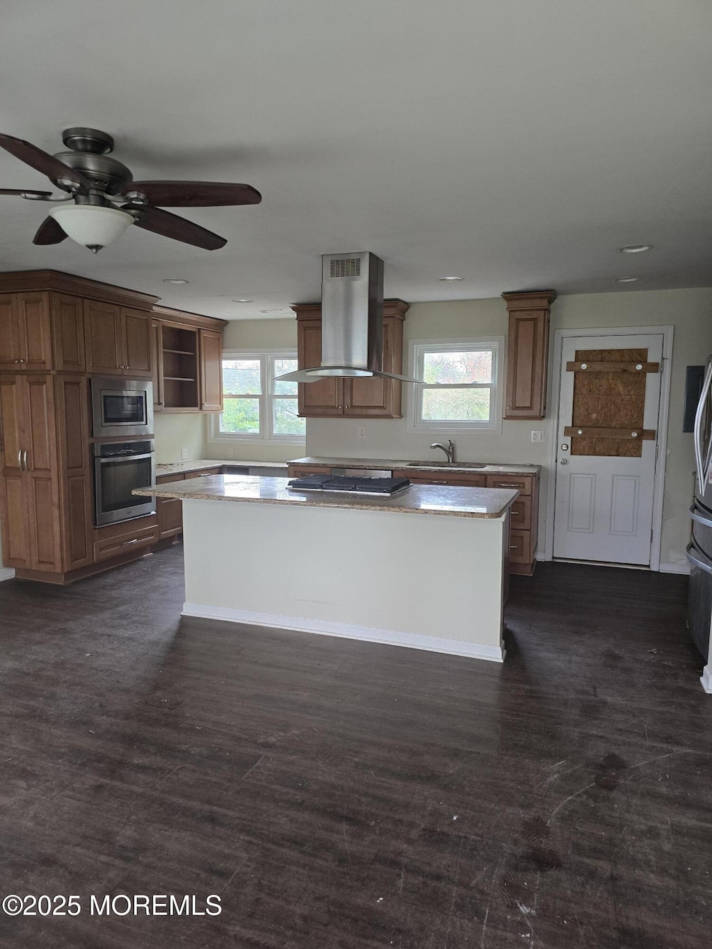 1066 Overlook Dr, Toms River, NJ 08753 - kitchen with open shelves, extractor fan, a center island, a ceiling fan, and appliances with stainless steel finishes