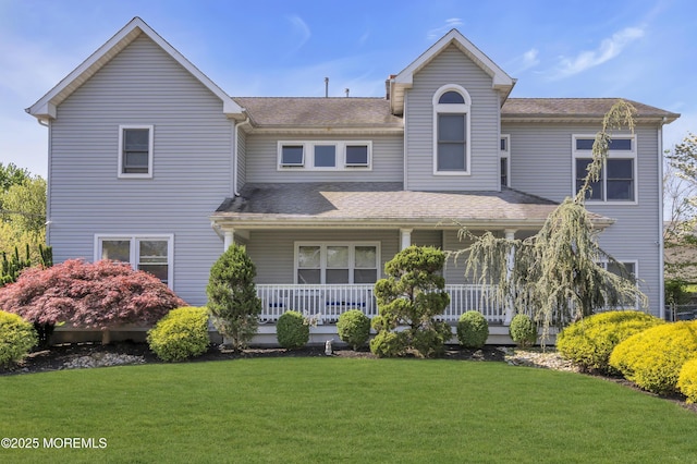 14 Dolan Ave, Aberdeen, NJ 07747 - view of front of home with a porch, roof with shingles, and a front yard