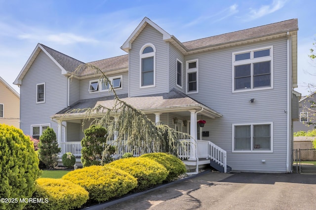 14 Dolan Ave, Aberdeen, NJ 07747 - view of front facade featuring a porch, fence, and roof with shingles