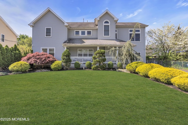 14 Dolan Ave, Aberdeen, NJ 07747 - view of front of home with fence, covered porch, and a front yard