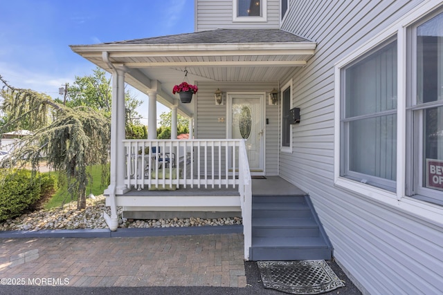 14 Dolan Ave, Aberdeen, NJ 07747 - property entrance featuring roof with shingles and covered porch