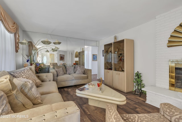14 Dolan Ave, Aberdeen, NJ 07747 - living area featuring a brick fireplace and dark wood-style flooring