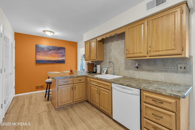 14 Dolan Ave, Aberdeen, NJ 07747 - kitchen with visible vents, a sink, light wood-style flooring, and dishwasher