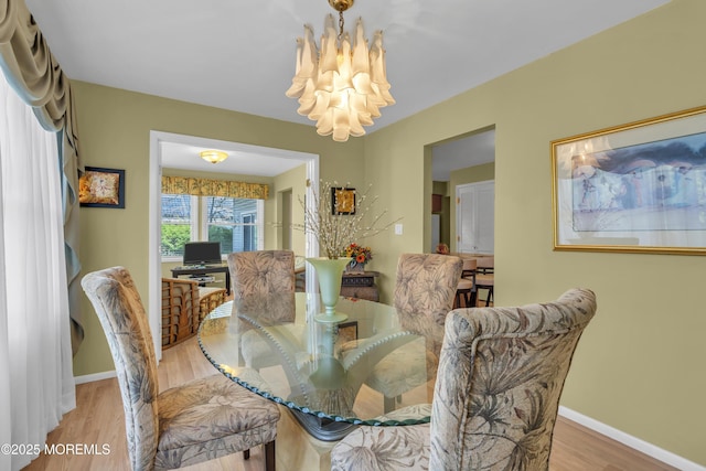 14 Dolan Ave, Aberdeen, NJ 07747 - dining room with baseboards, a notable chandelier, and wood finished floors