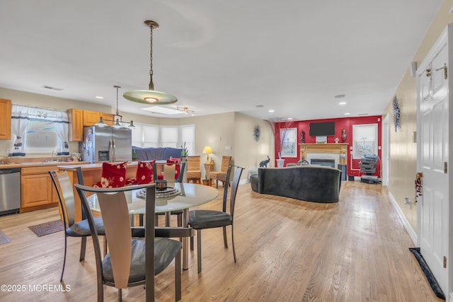 14 Dolan Ave, Aberdeen, NJ 07747 - dining space featuring a fireplace, recessed lighting, baseboards, light wood-type flooring, and visible vents