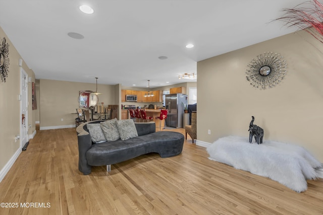 14 Dolan Ave, Aberdeen, NJ 07747 - living room with baseboards, recessed lighting, and light wood-style flooring