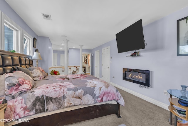 14 Dolan Ave, Aberdeen, NJ 07747 - bedroom featuring a glass covered fireplace, baseboards, ornate columns, recessed lighting, and carpet flooring
