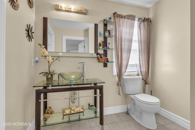 14 Dolan Ave, Aberdeen, NJ 07747 - bathroom featuring baseboards, a sink, tile patterned floors, and toilet