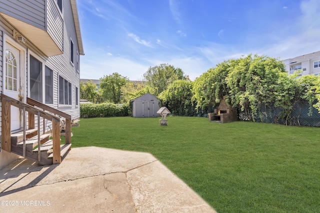 14 Dolan Ave, Aberdeen, NJ 07747 - view of yard with a patio area, a shed, an outbuilding, and a fireplace