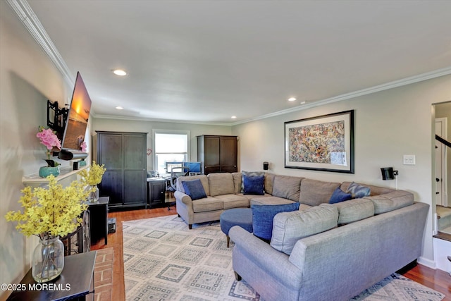 living area with recessed lighting, ornamental molding, and light wood-style floors