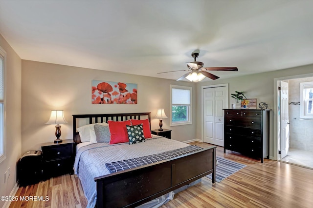 bedroom featuring a ceiling fan, baseboards, light wood finished floors, and a closet