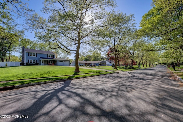 view of road with sidewalks and curbs